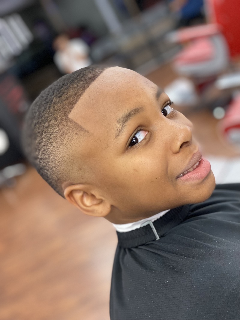 Young boy with fade haircut.