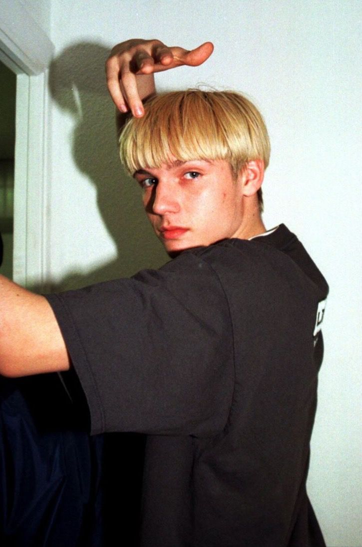 Nick Carter with a bowl cut from the 90s.